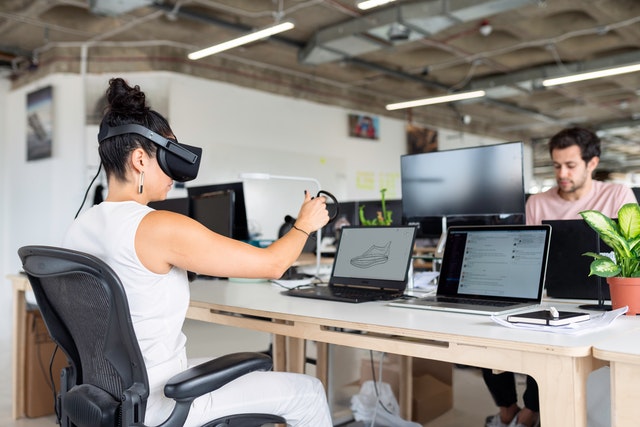 Image of woman using a virtual headset in the office